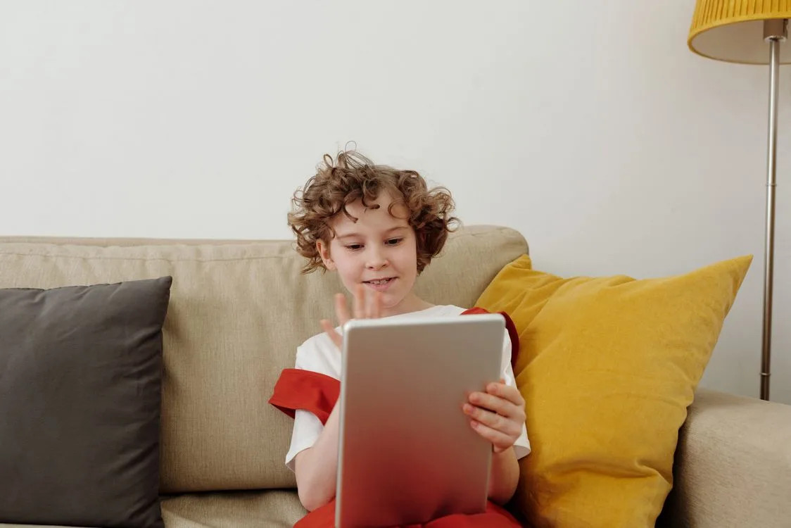 child using tablet for streaming
