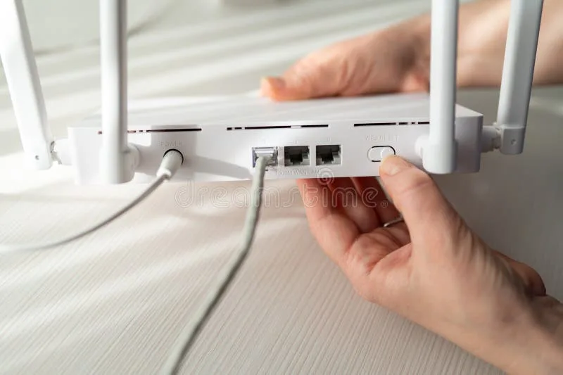 pressing reset button with paperclip