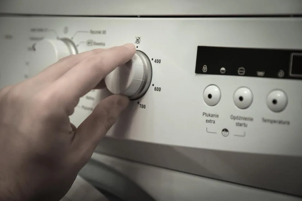 pressing washer buttons