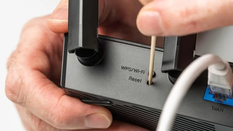 router reset button pinhole